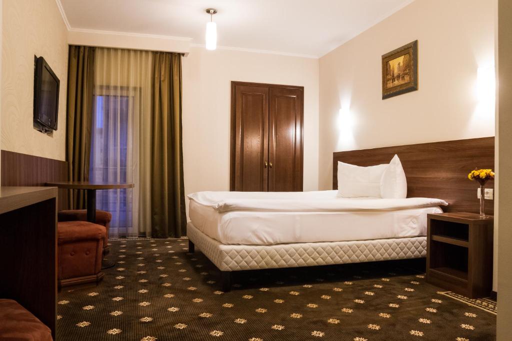 Postel nebo postele na pokoji v ubytování Hotel Hermes