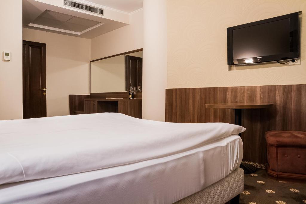 Postel nebo postele na pokoji v ubytování Hotel Hermes