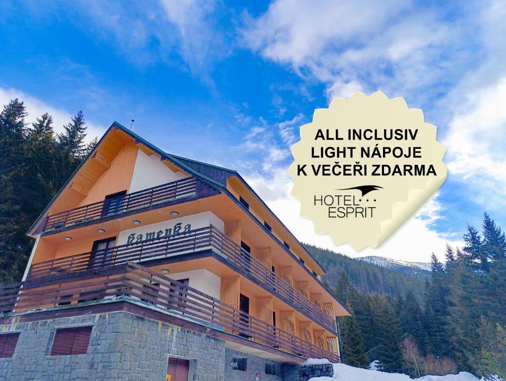 a building with the words all inclusive luxury light maple korean diana at Hotel Esprit in Špindlerův Mlýn