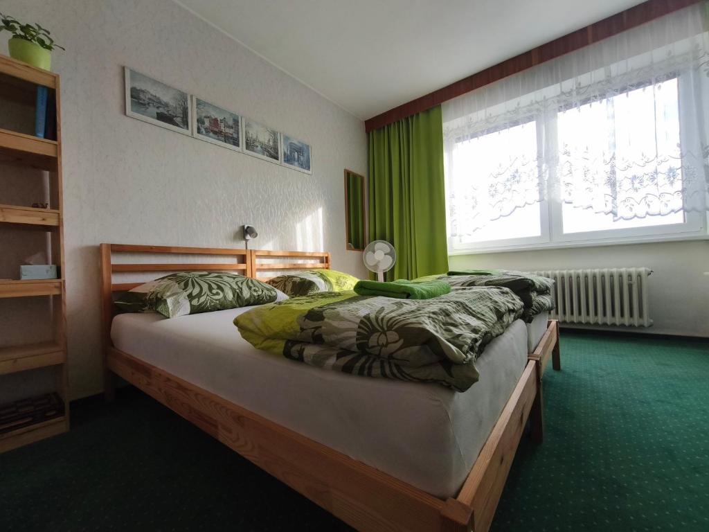 Postel nebo postele na pokoji v ubytování Green Room