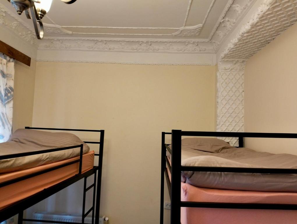 Letto o letti in una camera di Long Tree Hostel - Comfy Mattress