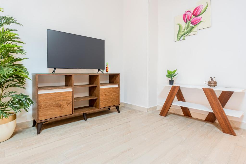 TV a/nebo společenská místnost v ubytování VESTA - El Sheikh Zayed Residence