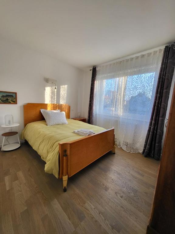 Postel nebo postele na pokoji v ubytování Les berges de l'Ill