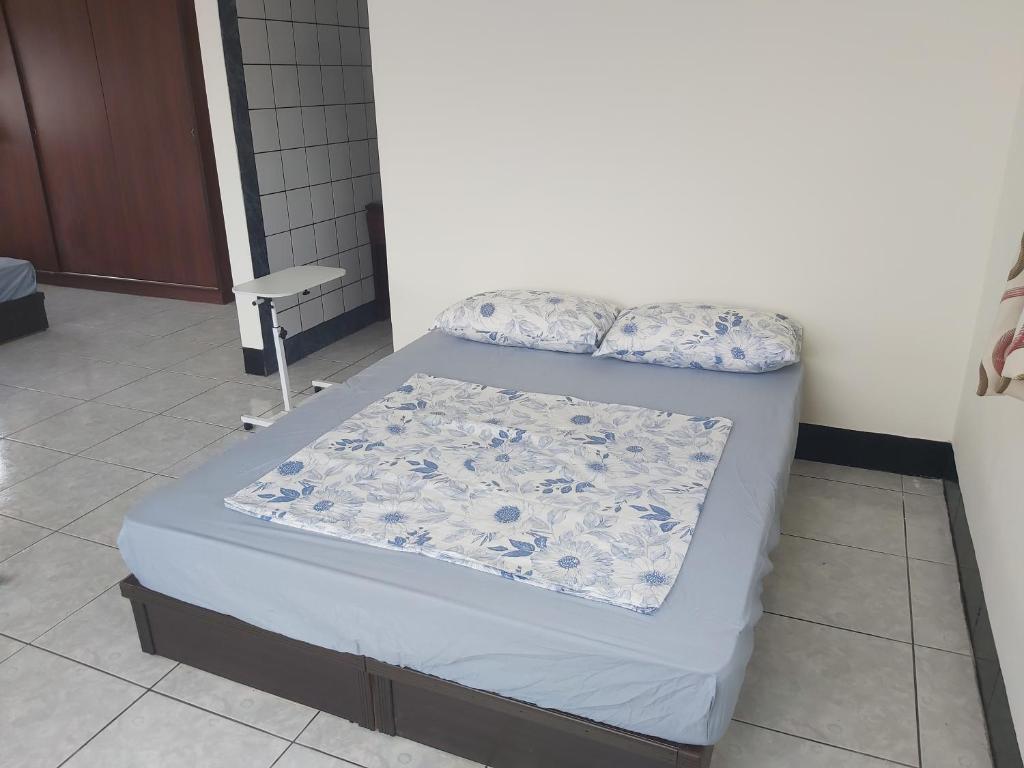 Postel nebo postele na pokoji v ubytování Huan Bei 88 Homestay