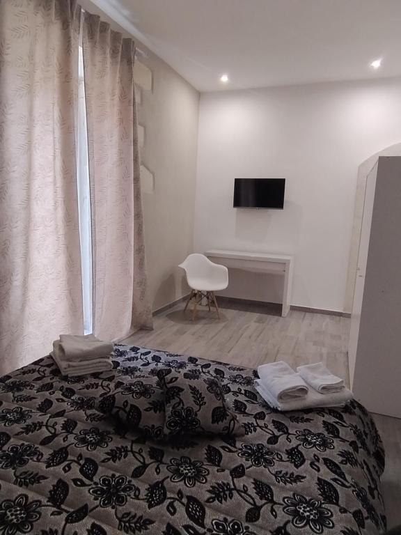 Postel nebo postele na pokoji v ubytování Square House Casa Vacanze