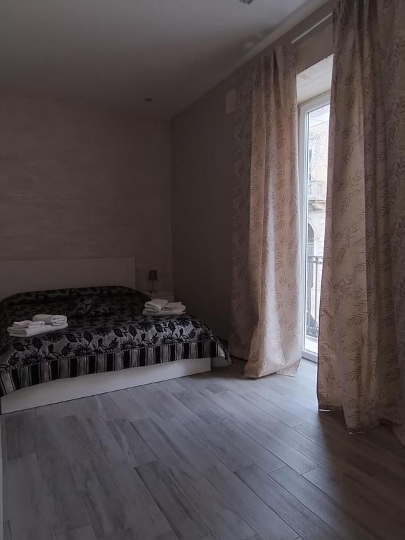 Postel nebo postele na pokoji v ubytování Square House Casa Vacanze
