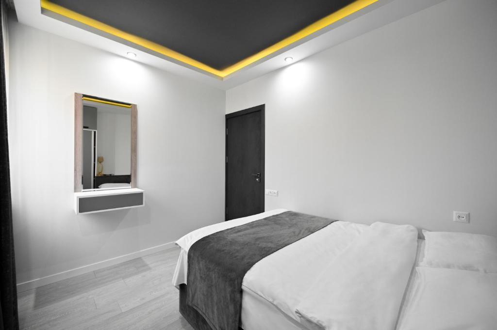 Postel nebo postele na pokoji v ubytování Mon Invite Hotel