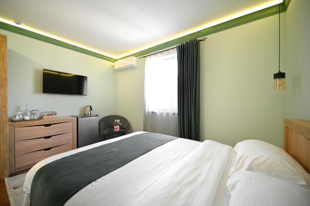 Postel nebo postele na pokoji v ubytování Mon Invite Hotel
