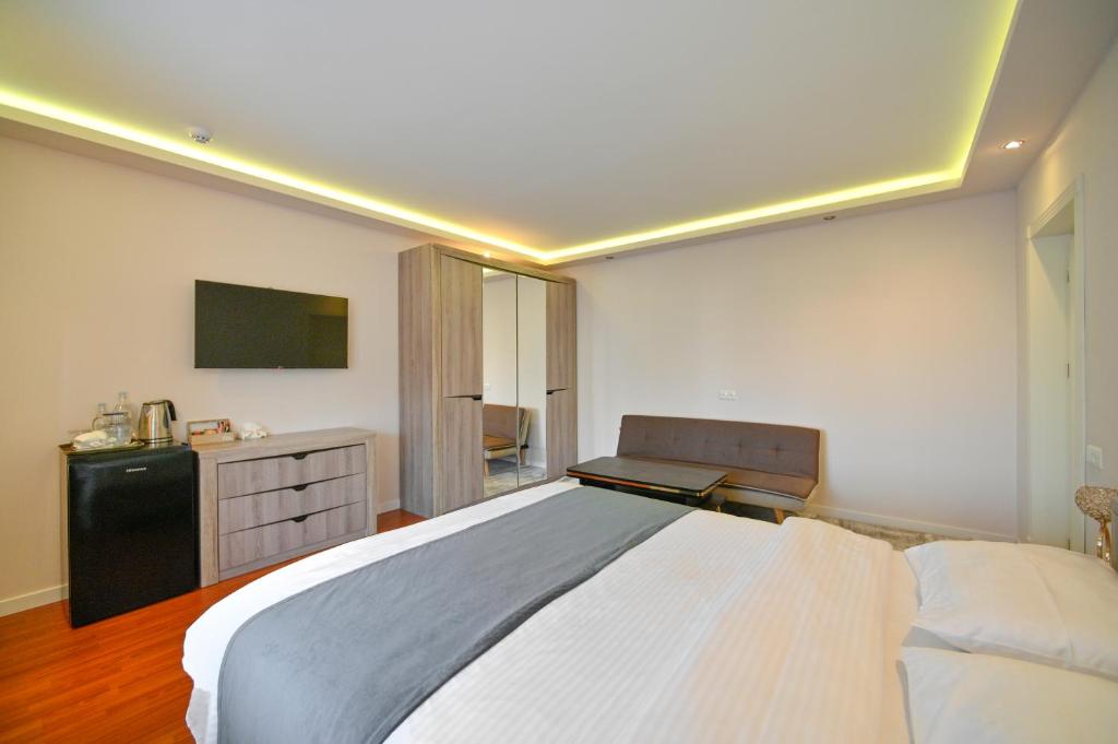 Postel nebo postele na pokoji v ubytování Mon Invite Hotel