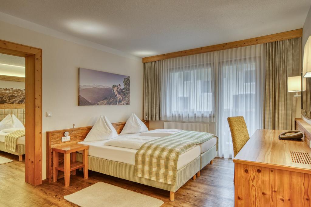 Postel nebo postele na pokoji v ubytování Hotel Alte Post