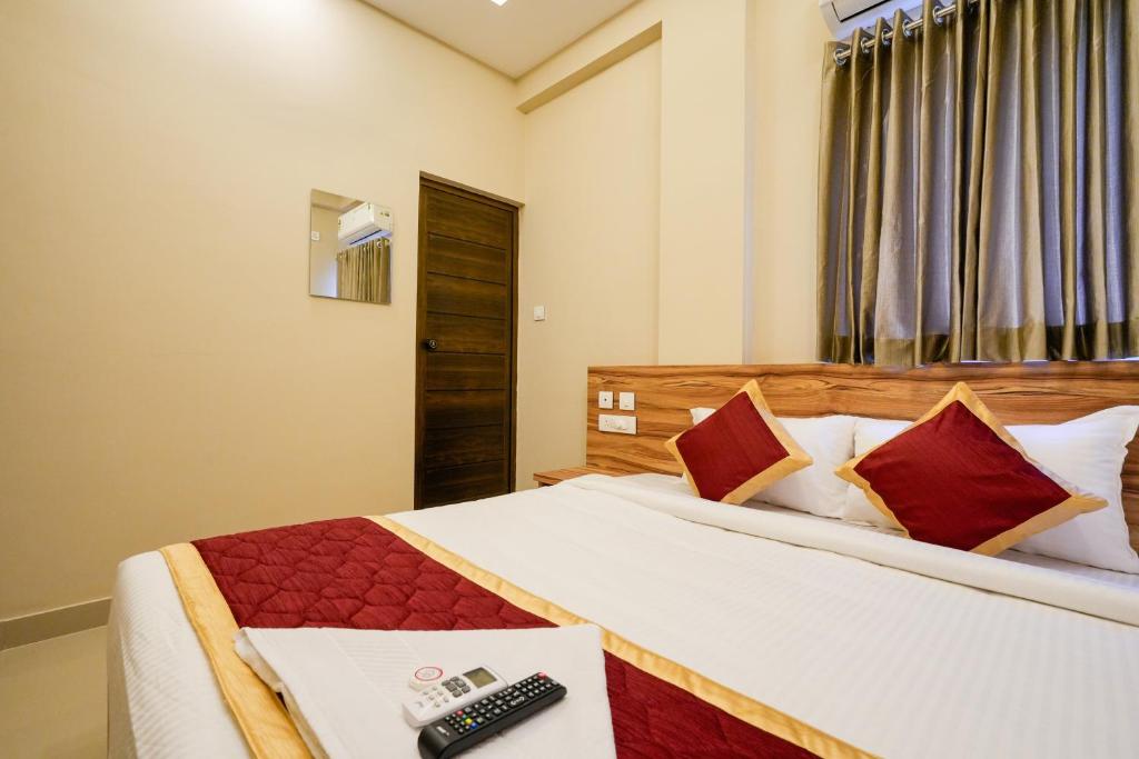 Postel nebo postele na pokoji v ubytování Yaad Inn