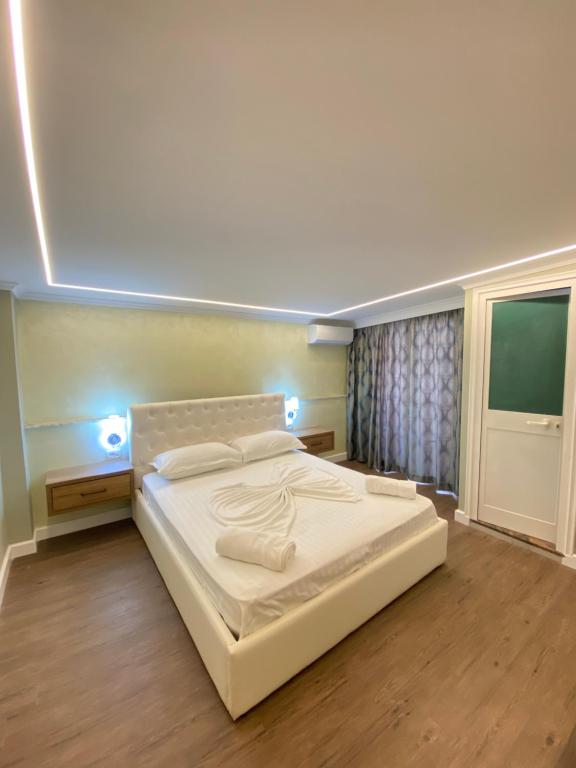 Postel nebo postele na pokoji v ubytování Bliss Boutique Hotel
