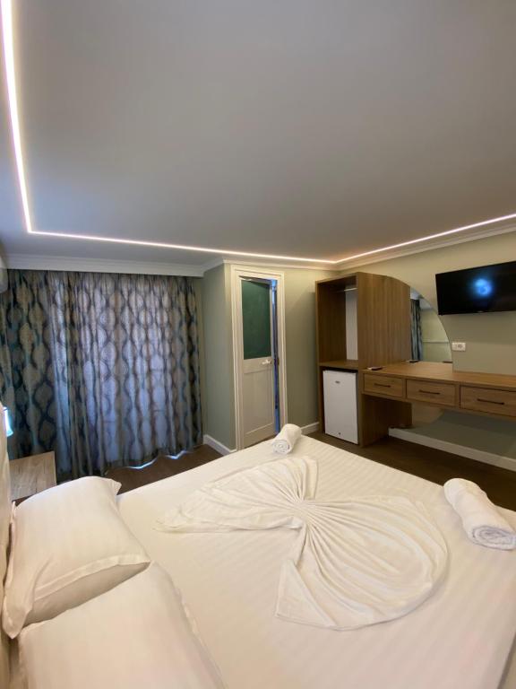 Postel nebo postele na pokoji v ubytování Bliss Boutique Hotel