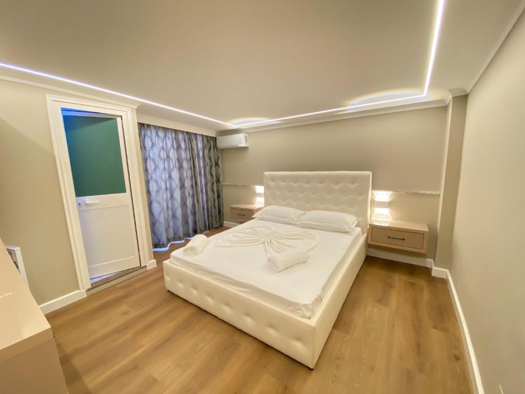 Postel nebo postele na pokoji v ubytování Bliss Boutique Hotel