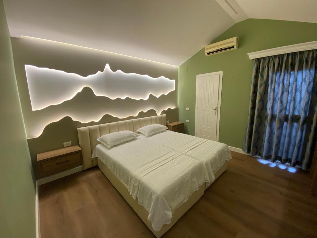 Postel nebo postele na pokoji v ubytování Bliss Boutique Hotel
