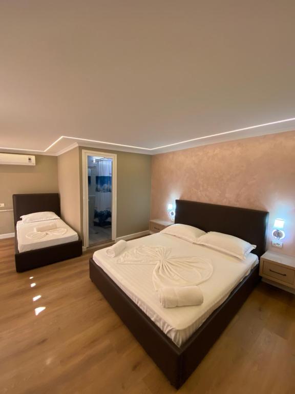 Postel nebo postele na pokoji v ubytování Bliss Boutique Hotel