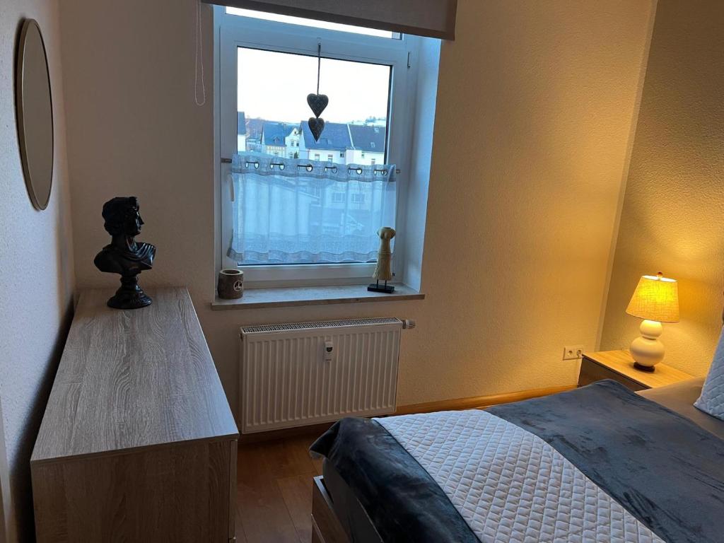 Postel nebo postele na pokoji v ubytování Zwönitz-Stübchen