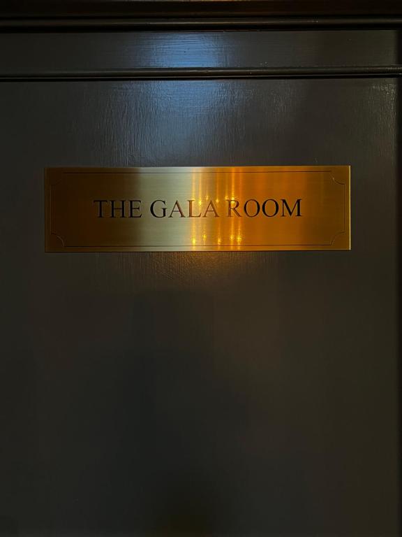 a sign that says the gala room on a door at 40 Winks Hospitality in Durham