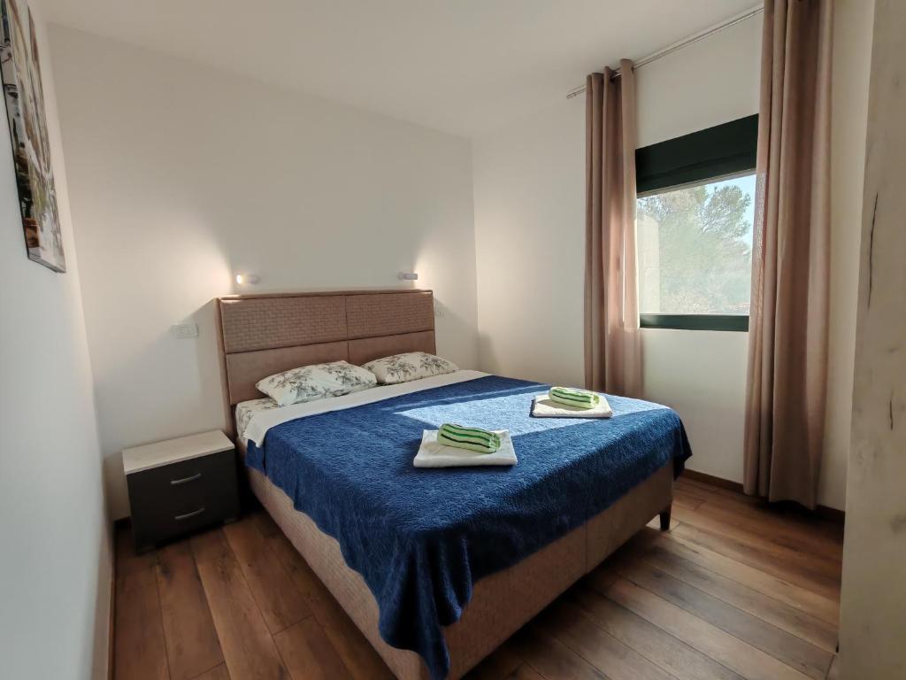 Postel nebo postele na pokoji v ubytování Forest Apartments