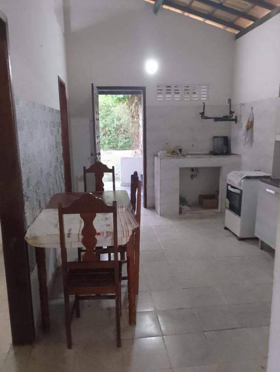 a room with a table and chairs in a kitchen at Jose s House in Conde