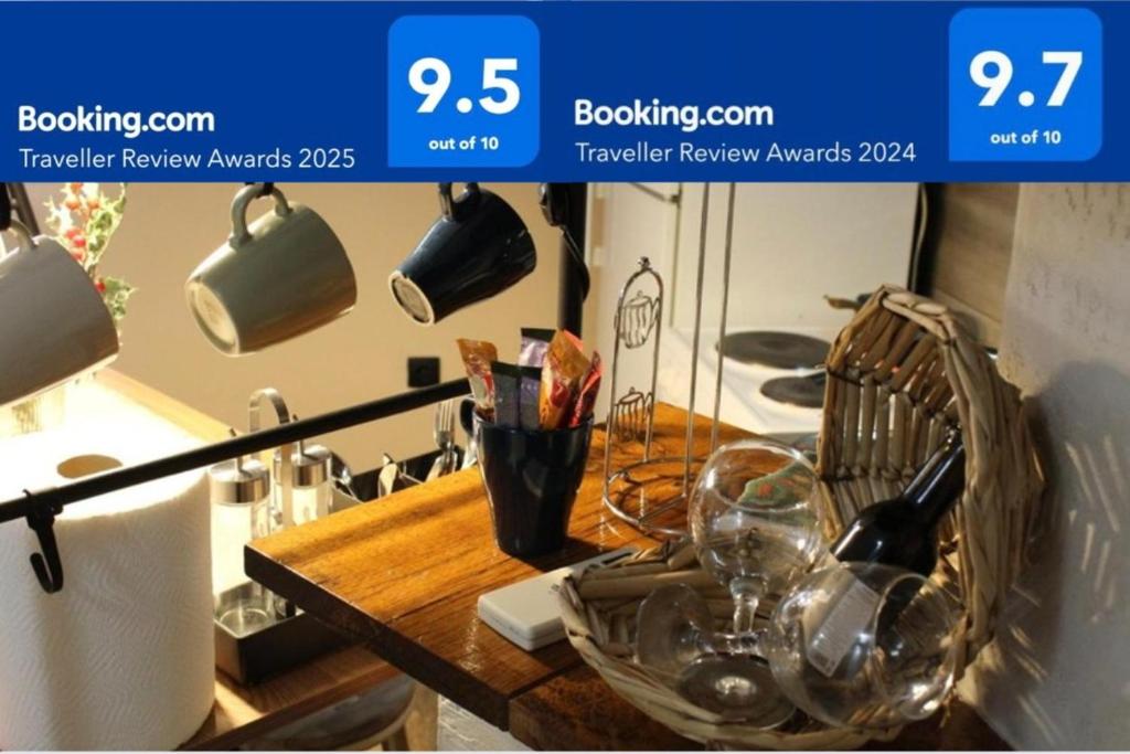 a kitchen counter with a table with glasses on it at Apartman AS in Belgrade