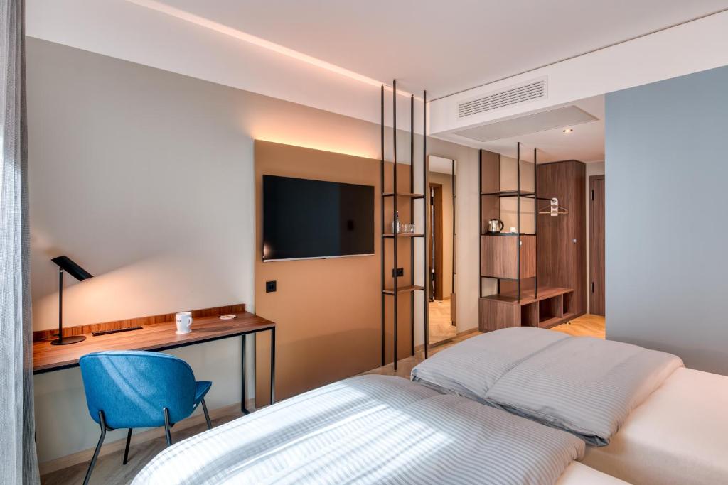 Postel nebo postele na pokoji v ubytování Stadthotel Neumarkt Mitte