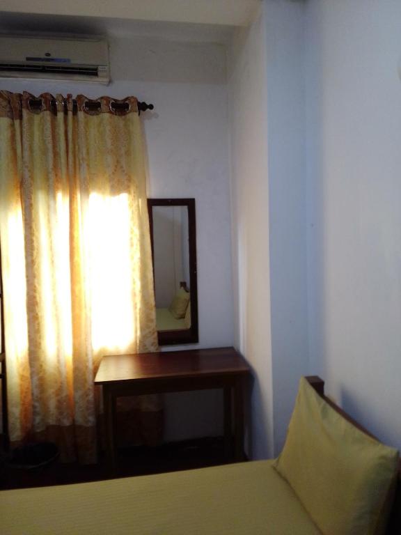 Postel nebo postele na pokoji v ubytování Pravindi Guest Home