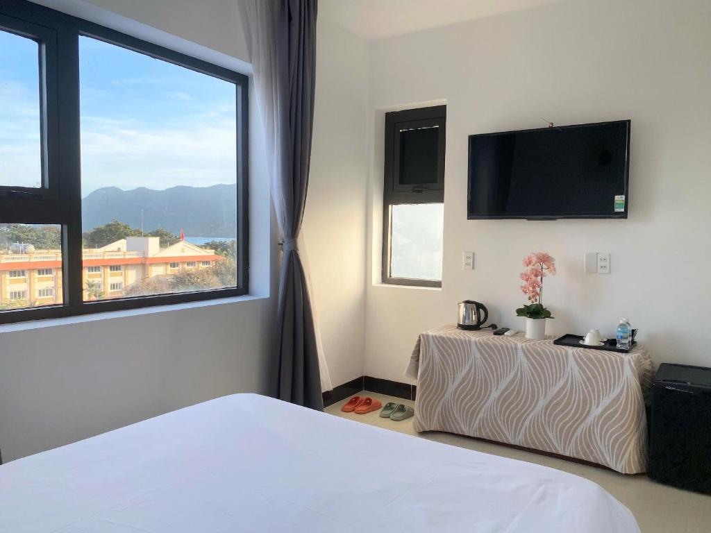 Postel nebo postele na pokoji v ubytování Horizon Côn Đảo Hotel