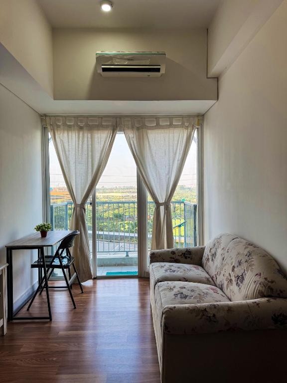 Posezení v ubytování Apt Casa De Parco 1BR With WiFi, Pool & Netflix by Damaresa