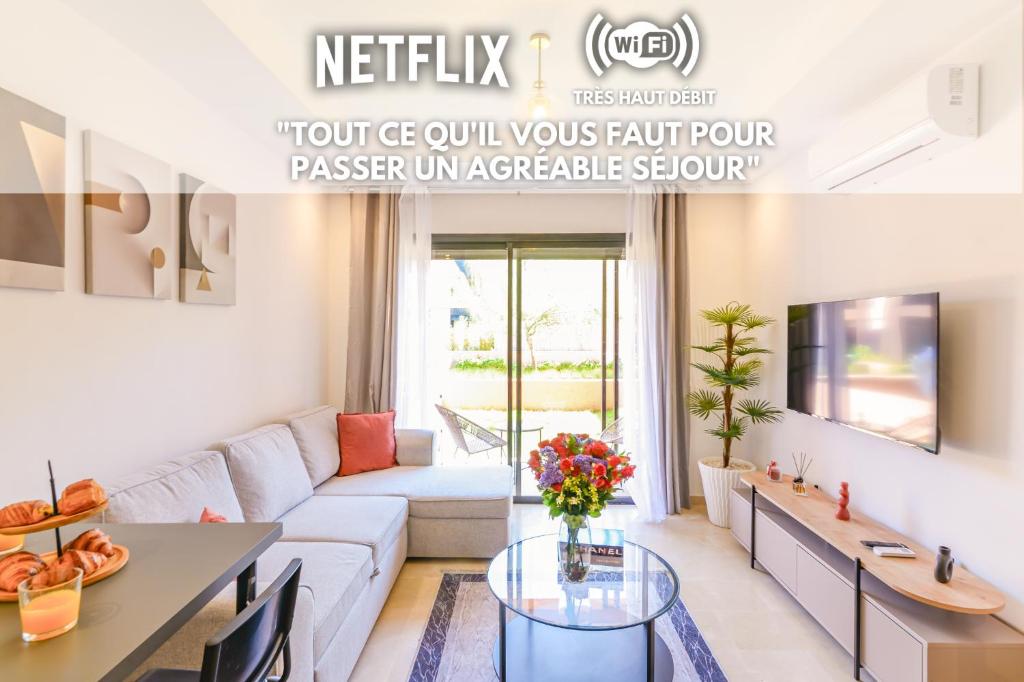 a living room with a couch and a table at Lina cosy - Clim, Wifi, Jardin à 10min de l'Aéroport in Marrakech