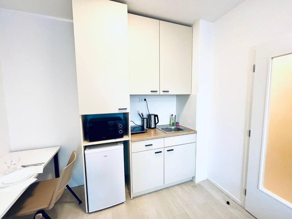 Kuchyň nebo kuchyňský kout v ubytování Bella Apartments Brno
