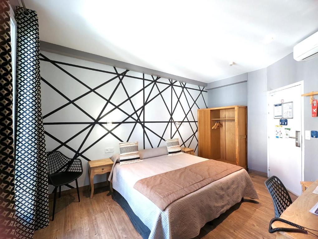 Postel nebo postele na pokoji v ubytování H33 Hôtel
