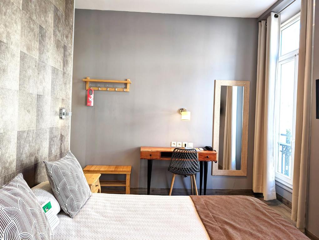 Postel nebo postele na pokoji v ubytování H33 Hôtel