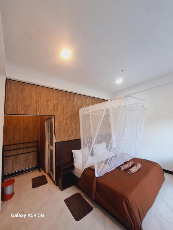 Postel nebo postele na pokoji v ubytování Ella Odyssey Inn