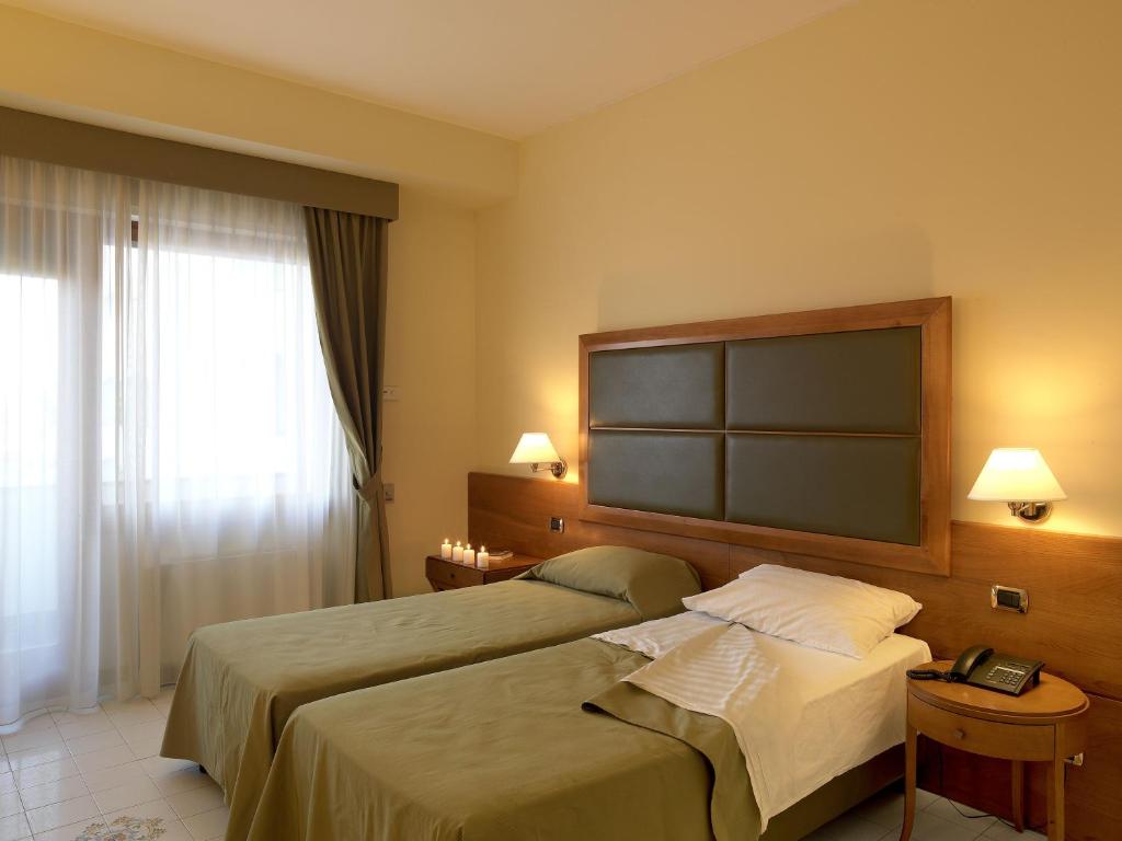 Postel nebo postele na pokoji v ubytování Grand Hotel Don Juan