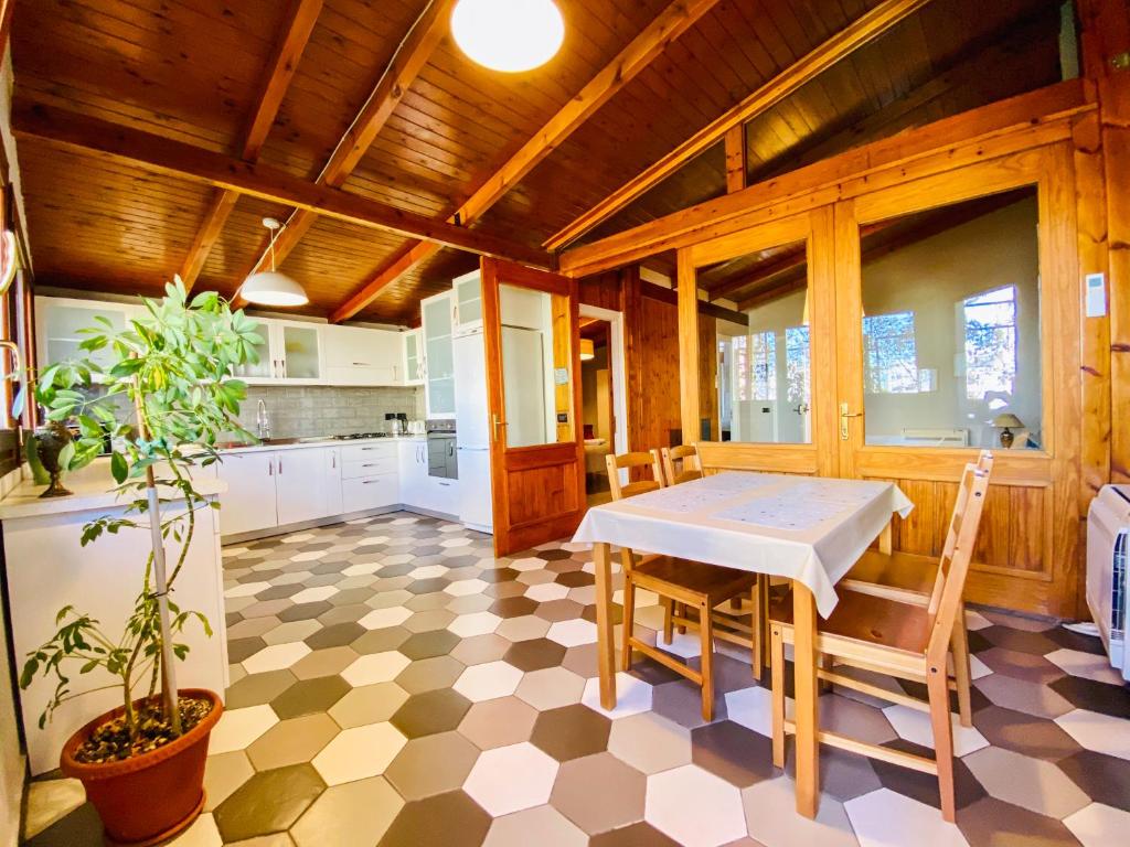 a kitchen with a table and chairs in a room at Tirana Experience, Authentic Stays in the Heart of Old Tirana in Tirana