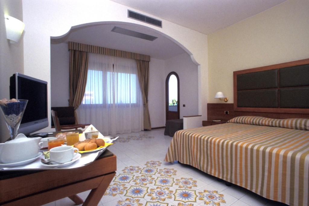 Postel nebo postele na pokoji v ubytování Grand Hotel Don Juan