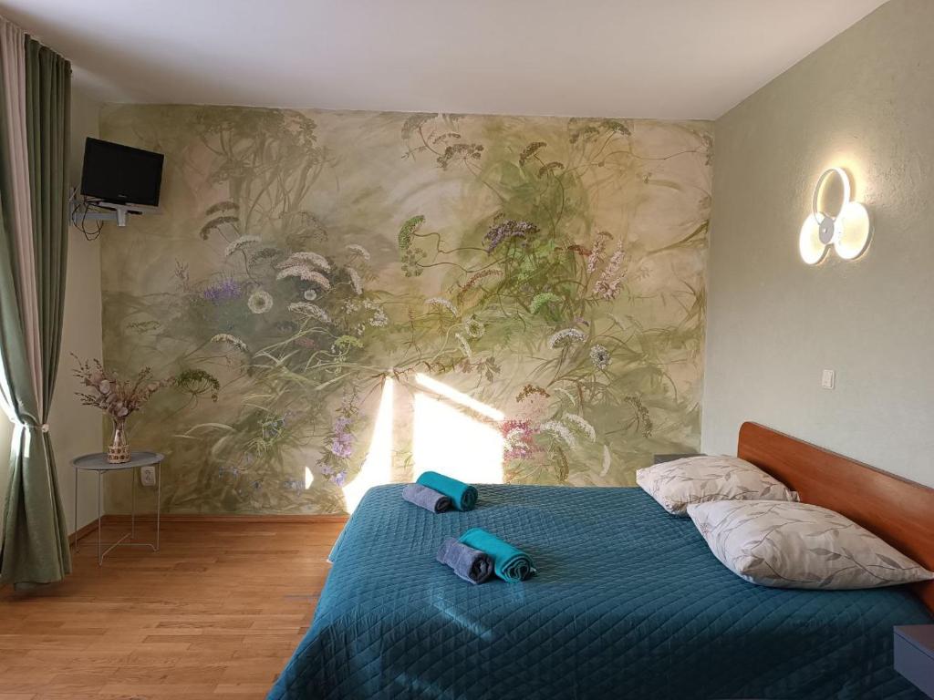 Ένα ή περισσότερα κρεβάτια σε δωμάτιο στο Вілла На Гірській