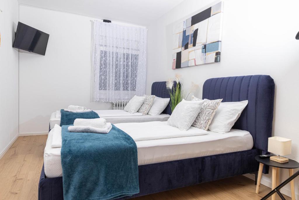 Postel nebo postele na pokoji v ubytování Apartman Tihana