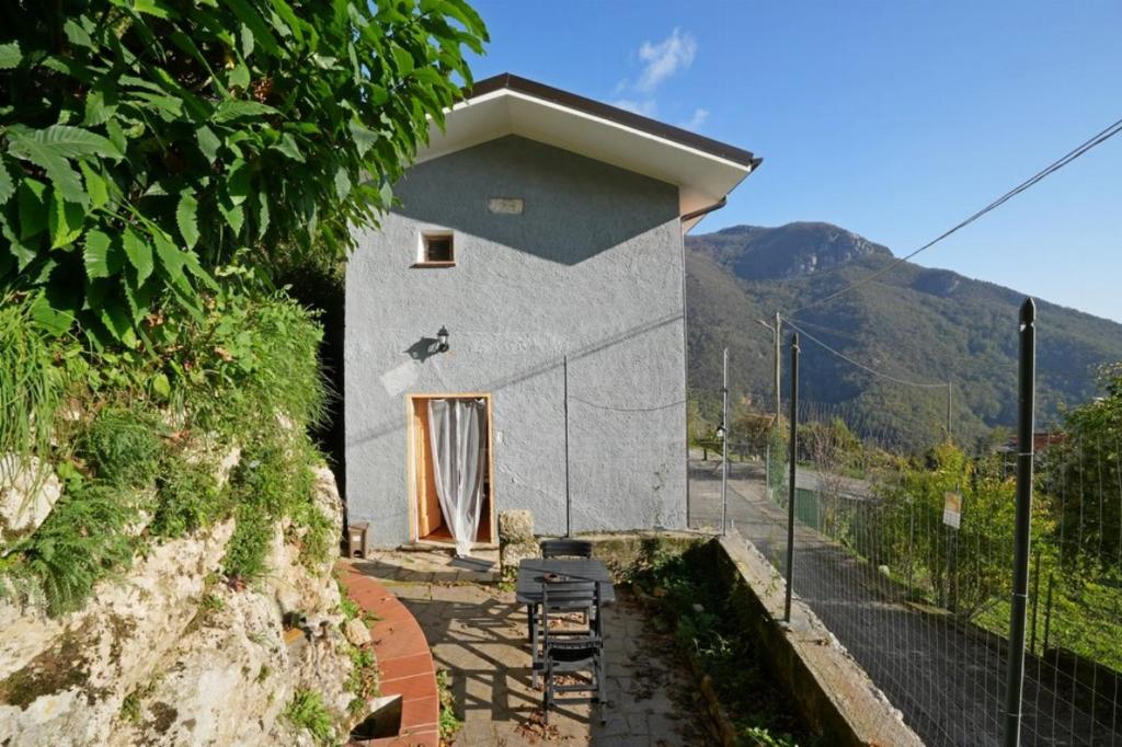 a small building with a door on the side of it at CASA SANT`ANNA DI STAZZEMA in Culla