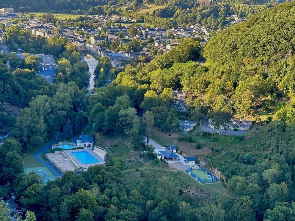 an aerial view of a house in a forest at village vacances du camboussel in Brassac