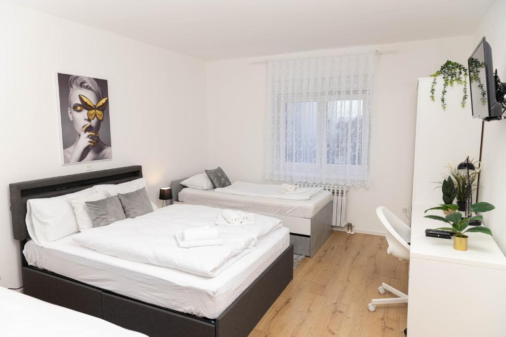 Postel nebo postele na pokoji v ubytování Apartman Tihana