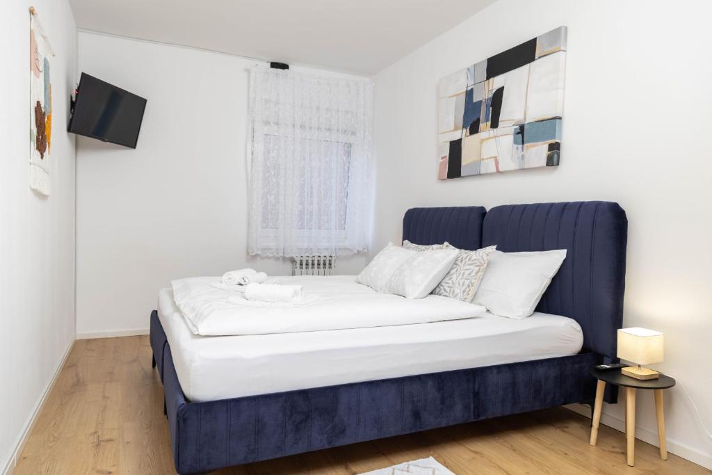 Postel nebo postele na pokoji v ubytování Apartman Tihana