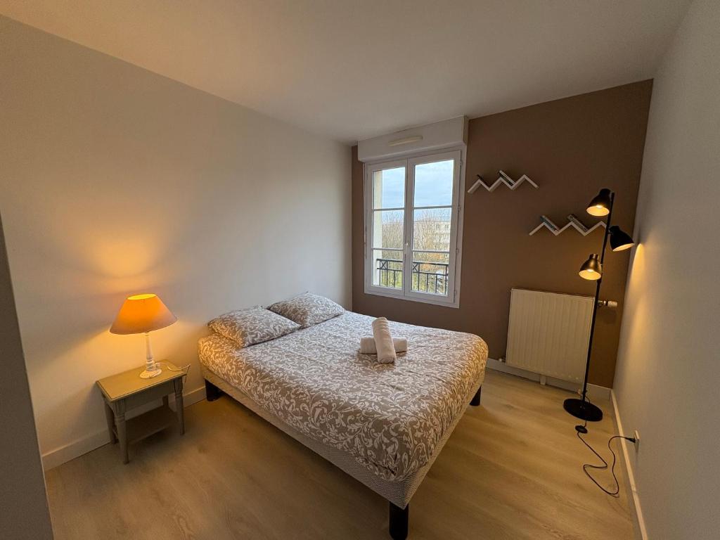 Postel nebo postele na pokoji v ubytování T5 Disney Paris/Val d’Europe