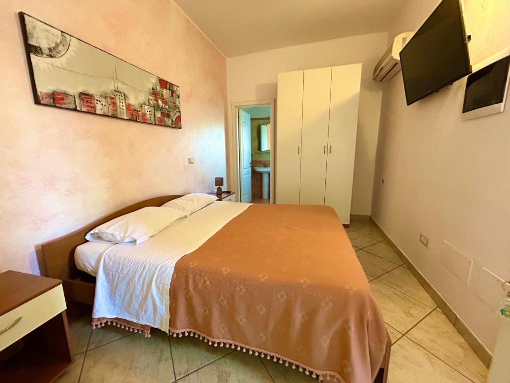 Postel nebo postele na pokoji v ubytování Hotel Costa Doro - Caffè