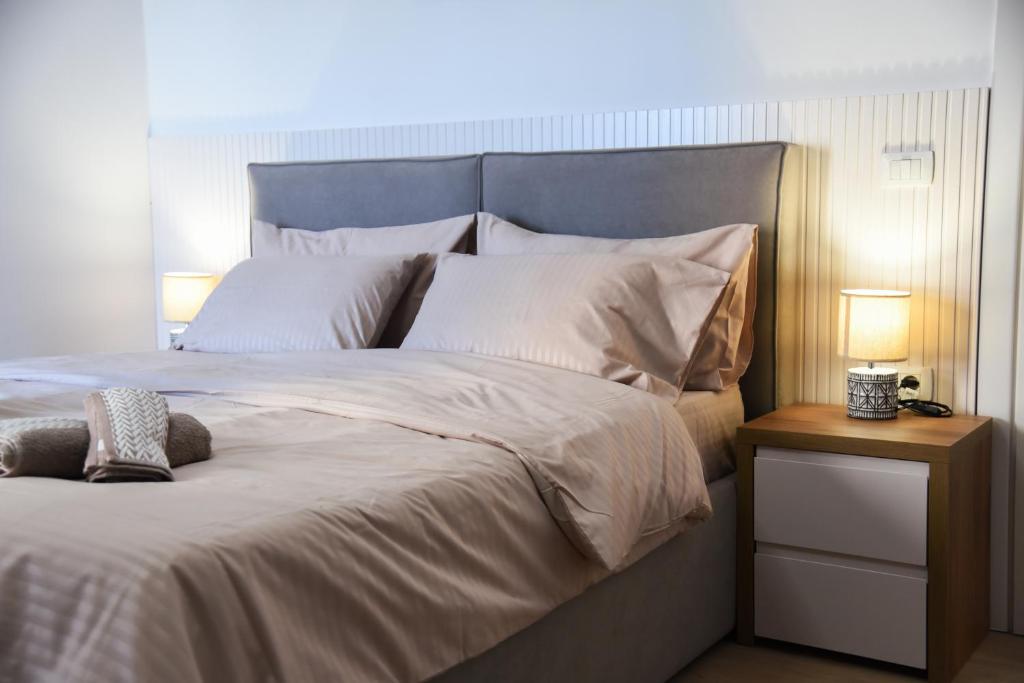 Postel nebo postele na pokoji v ubytování Seaside Grand Stay Apartment