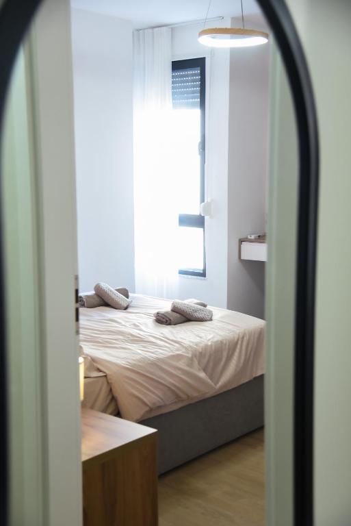 Postel nebo postele na pokoji v ubytování Seaside Grand Stay Apartment