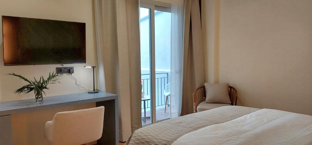 TV a/nebo společenská místnost v ubytování Elite Patras Suites