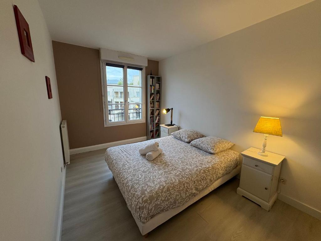 Postel nebo postele na pokoji v ubytování T5 Disney Paris/Val d’Europe