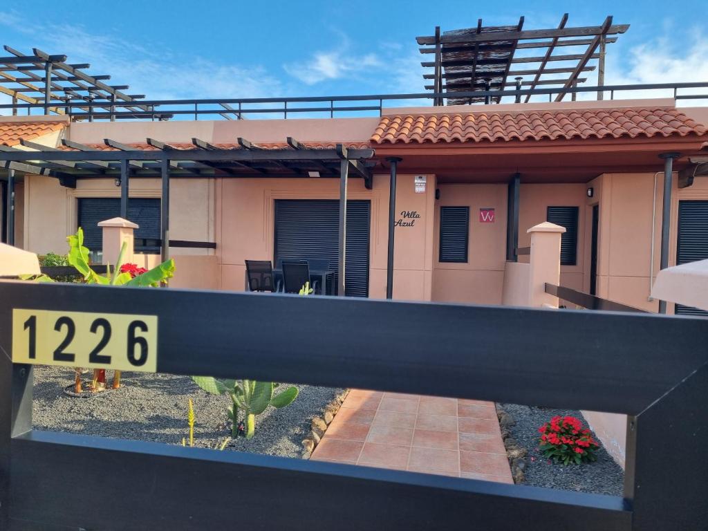 a house with a sign in front of it at Casa Azul in Lajares